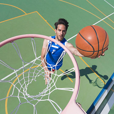 Top view of of young basketbal player scoring